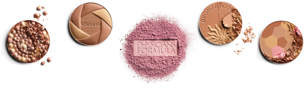 Collection of Physicians Formula makeup products including powders and a blush with a brand logo in the center.